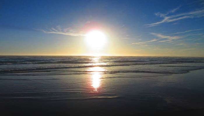 A photo of a sunset on a beach in Tofino, BC, Canada. Creates intimate feelings of romance, passion, and keeping the sparks alive.