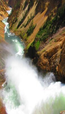 Photo of the Grand Canyon of Yellowstone with rushing waterfall and stream. It cleanses and smooths the rock just like we can cleanse and soothe ourselves, keeping mindful tips handy as we move forward in the new year.