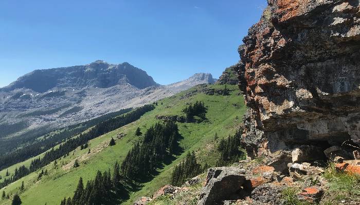 A photo representing how we can rise above challenges on a hike in the extreme heat at Wind Ridge, near Canmore, Alberta, Canada.