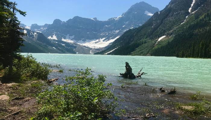 A photo of Chephren Lake, Icefields Parkway, Alberta, Canada. When we get out in nature we can reflect on ourselves, such as people pleasing and how to set healthy boundaries.