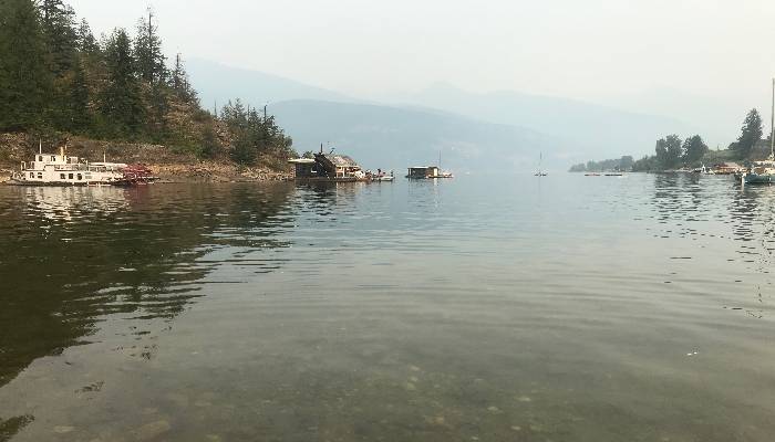 A photo of smoky skies at the lake in Kalso, BC. Admiring the smoke, even though not idea can help us in letting things be, and loving whatever arises.