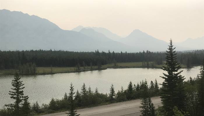 A photo of a smoky mountain scene in Kananaskis, Alberta, Canada. Managing change through smoky, difficult times can be achieved with these steps.