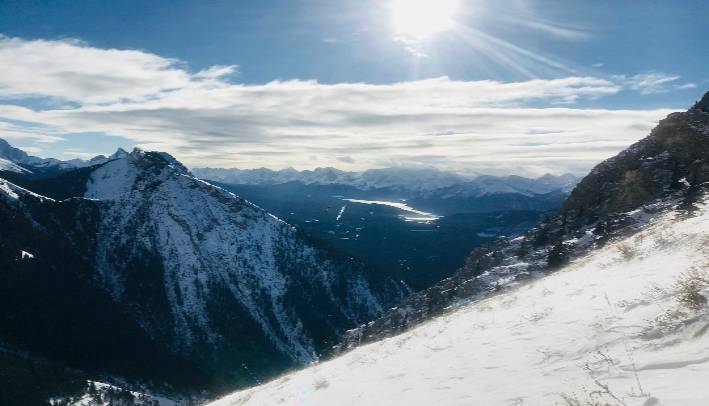 A photo of Grizzly Peak, Kananaskis, Alberta, Canada with some radiant sun beams shining down like the inner light of our souls can shine.