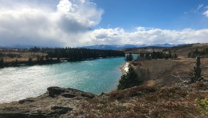 A photo of Ghost River, Alberta, Canada. The river flows with ease, over obstacles and we are the river, letting things be, conquering fear and resistance.