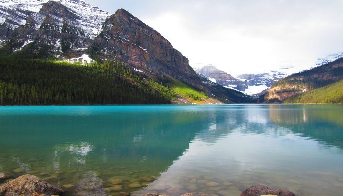 A photo of a calm Lake Louise, Alberta, Canada, but weather can change dramatically and quickly, just like dealing with the unexpected in our lives can throw us off balance.