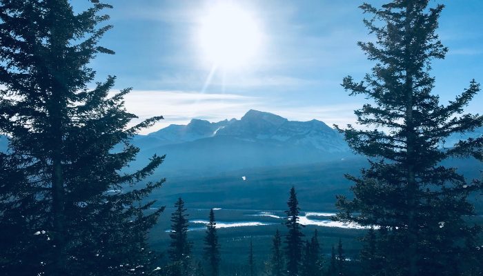 Try these Winter Solstice practices to help you stay warm in the colder months, like here at Castle Mountain Lookout in Banff, Alberta, Canada.